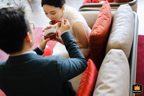 Groom feeding bride sweet soup at a traditional wedding in Shanghai, China.